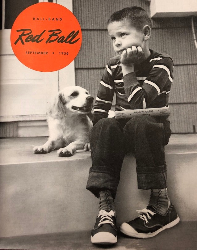 a boy wearing red ball jets with his puppy