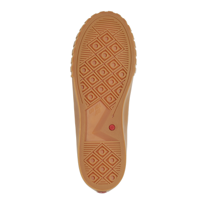 White sneaker with gum sole on a white background