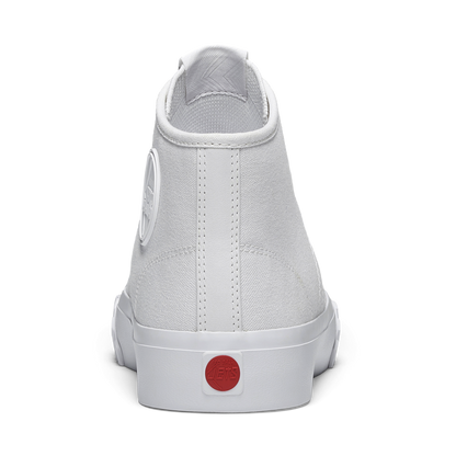 White sneaker with a red sole on a white background