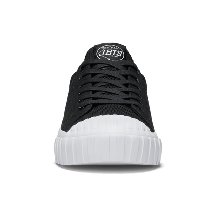 Black sneaker with white sole on a white background