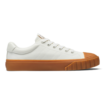 White sneaker with gum sole on a white background