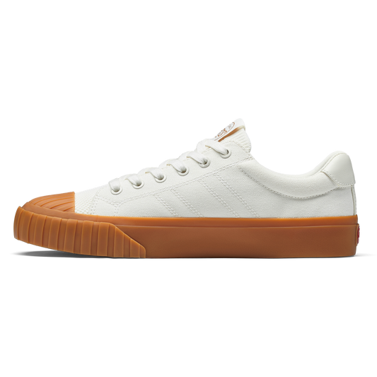 White sneaker with gum sole on a white background