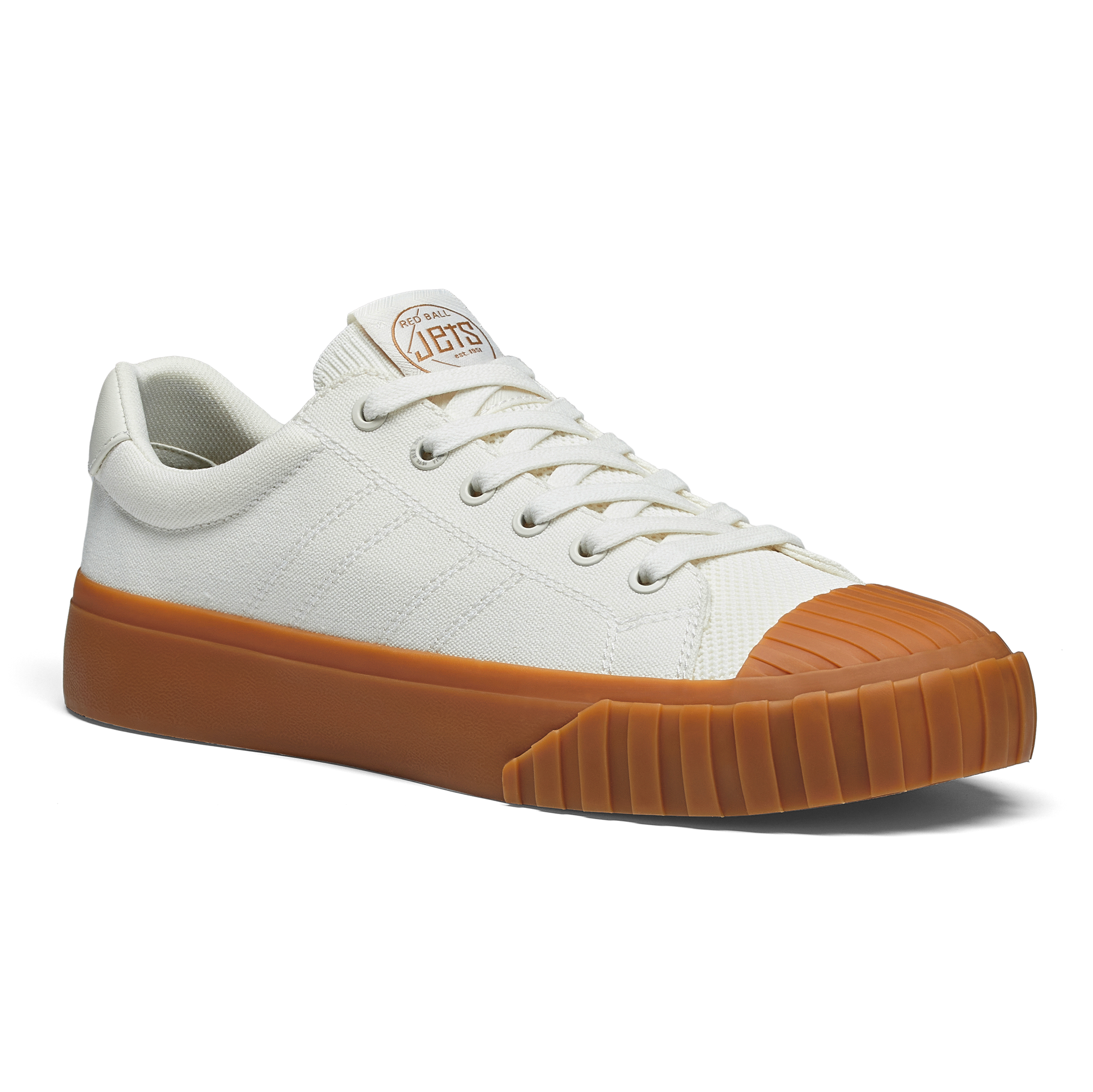 White sneaker with gum sole on a white background