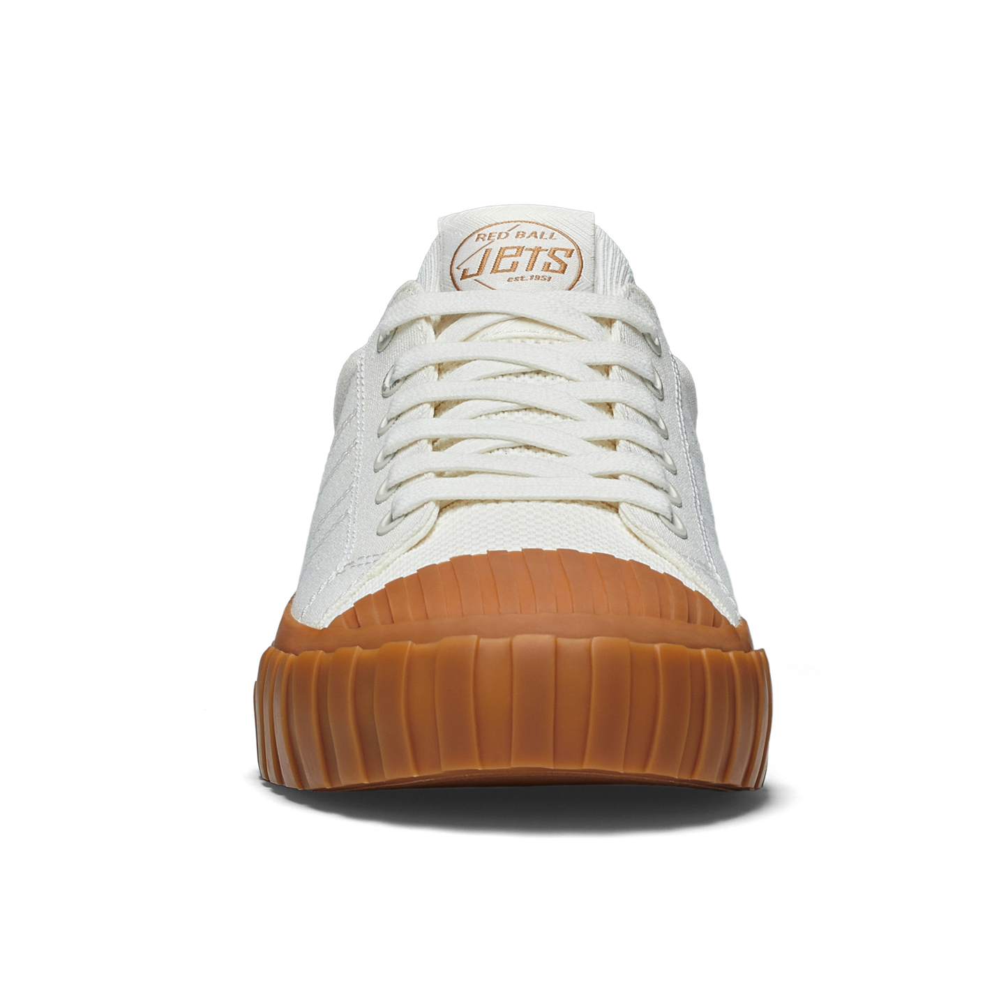 White sneaker with gum sole on a white background