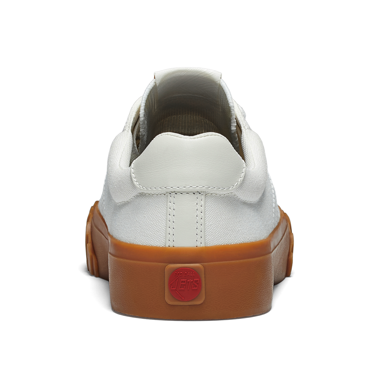 White sneaker with gum sole on a white background