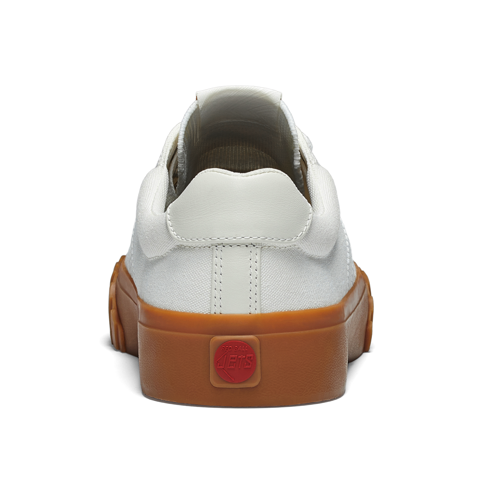 White sneaker with gum sole on a white background