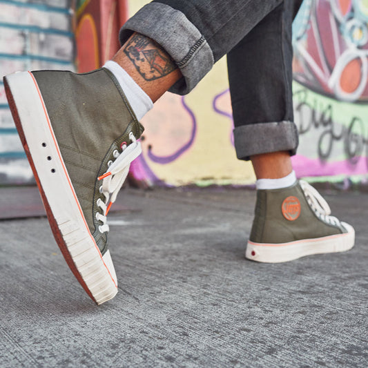 a person walking wearing the olive 51 hi
