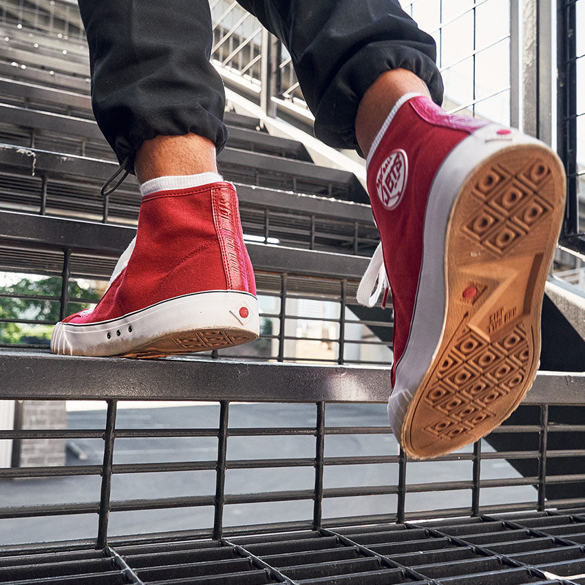 a person walking up stairs with the red 51 hi