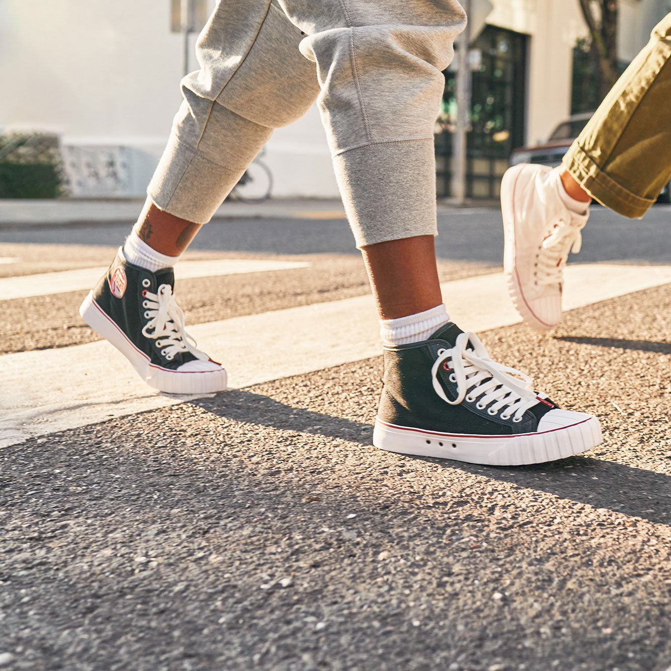 a person wearing black and red 51 hi with gray pants